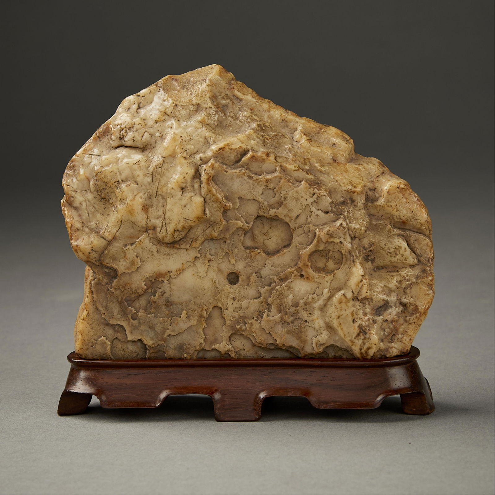Chinese Soapstone Scholar's Rock: Chinese soapstone scholar's rock. With a custom carved wooden stand. Reminiscent of a landscape.(Incl Stand) Height: 4 3/4 in x width: 4 1/2 in x depth: 1 1/2 in.