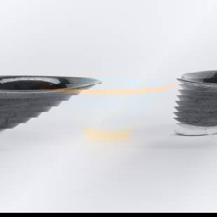 Chinese Henan Black Glazed Flared Tea Bowl: Chinese Henan black-glazed flared tea bowl, Northern Song Dynasty. The exterior under a blue-black glaze thinning to a light brown tone at the everted rim and falling short of the unglazed foot reveal