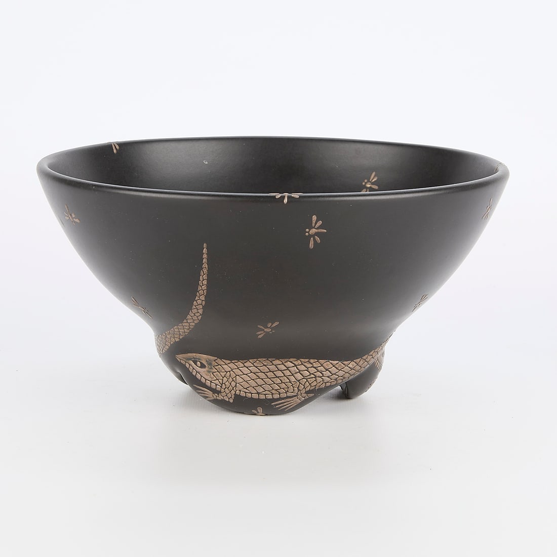 Emilia Castillo Porcelain & Sterling Bowl: Emilia Castillo (Mexican, 20th c). Taxco porcelain serving bowl with sterling silver overlay depicting lizards and insects. Marked along the underside.Height: 5 1/4 in x diameter: 9 3/4 in.