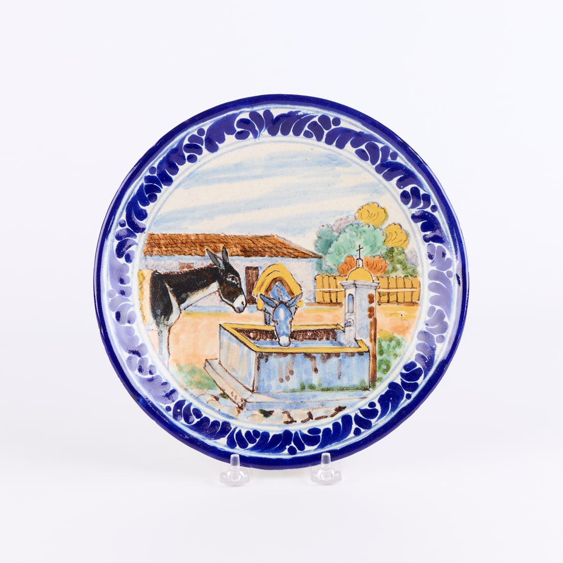 Rare Uriate Mexican Talavera Pottery Scenic Plate: Uriarte Talavera Pottery, Puebla, Mexico. Rare folk art "Talavera" tourist pottery pictorial plate depicting two burro donkeys at a water trough, ca. 1940s. With two-dot Uriarte mark along t