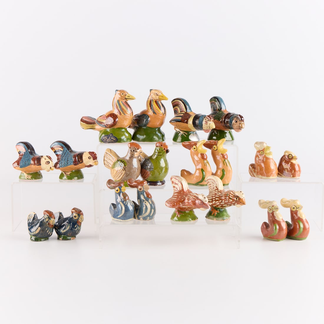 20 Mexican Tlaquepaque Hen Salt & Pepper Shakers: Large group of vintage folk art Mexican "Tlaquepaque" tourist pottery salt and pepper shakers in the form of roosters, hens, and chickens, ca. 1940s-1950s. Including 20 pieces total (ten pai