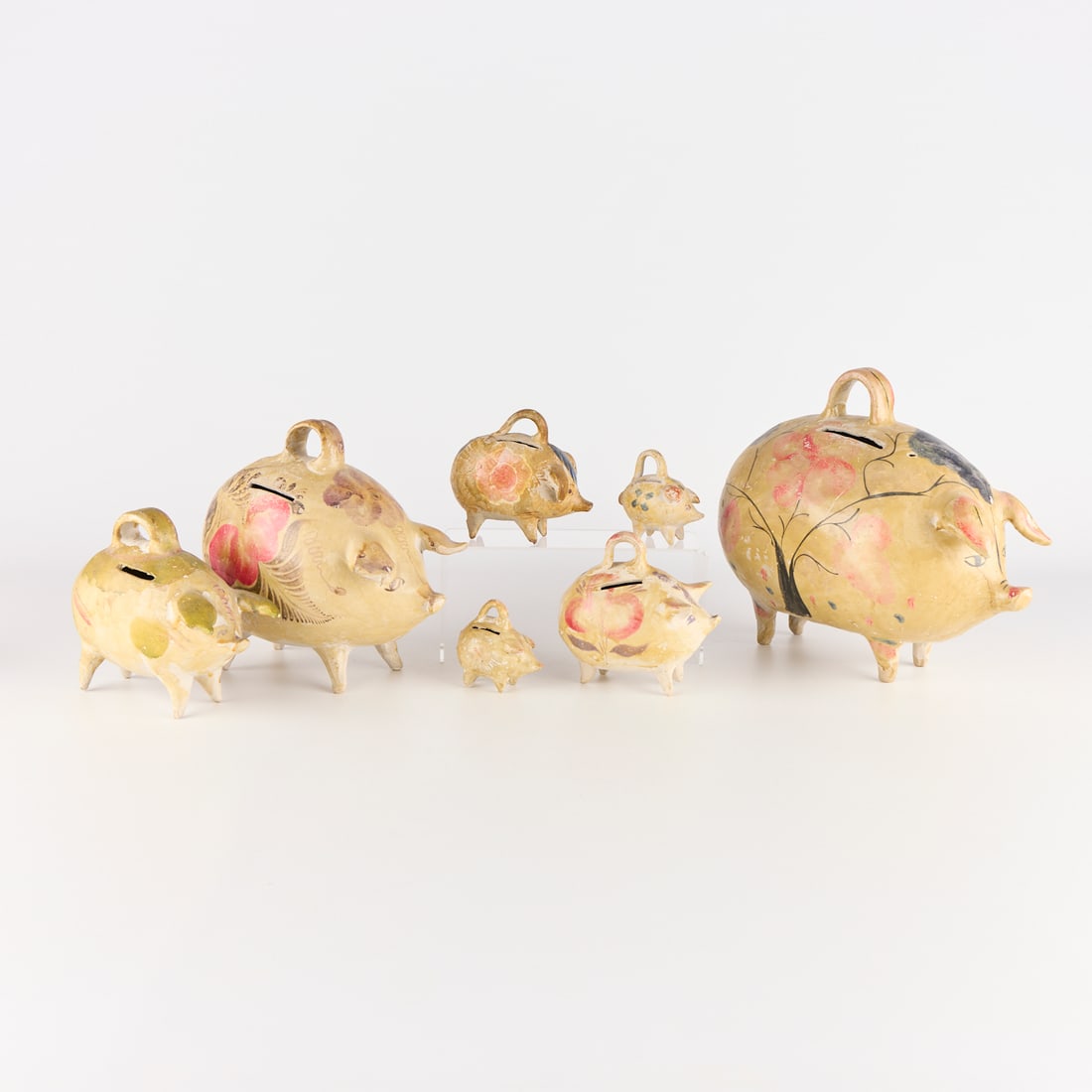 7 Mexican Folk Art Tlaquepaque Pottery Piggy Banks: Group of seven vintage Mexican folk art Tlaquepaque, Jalisco tourist pottery molded pig banks, ca, 1930s-1940s. For similar examples see: Donna McMenamin, "Popular Arts of Mexico: 1850-1950,"