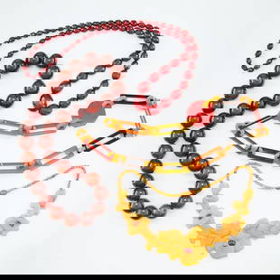 4 Bakelite & Amber Necklaces: Group of four bakelite and amber necklaces including:One large bakelite necklace with 20mm translucent bakelite beads, no clasp.One multi color bakelite link necklace comprised of black, red, orange a