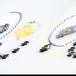 3 Pieces Billiard Themed Bakelite Jewelry: Group of three pieces of billiard/pool themed bakelite jewelry, including:One necklace on white chain suspending seven eight balls suspended on metal links. With and older spring clasp closure. Unmark