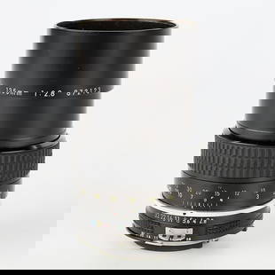 Nikon Nikkor Ai 135mm f2.8 Lens: Nikon, Japan. Lens, 135 mm, f2.8 Nikkor Ai, Serial #872123, produced 1977-1981. With a Hoya 52mm UV[0] lens filter and a case.(Case) height: 5 1/2 in x diameter: 3 1/2 in.
