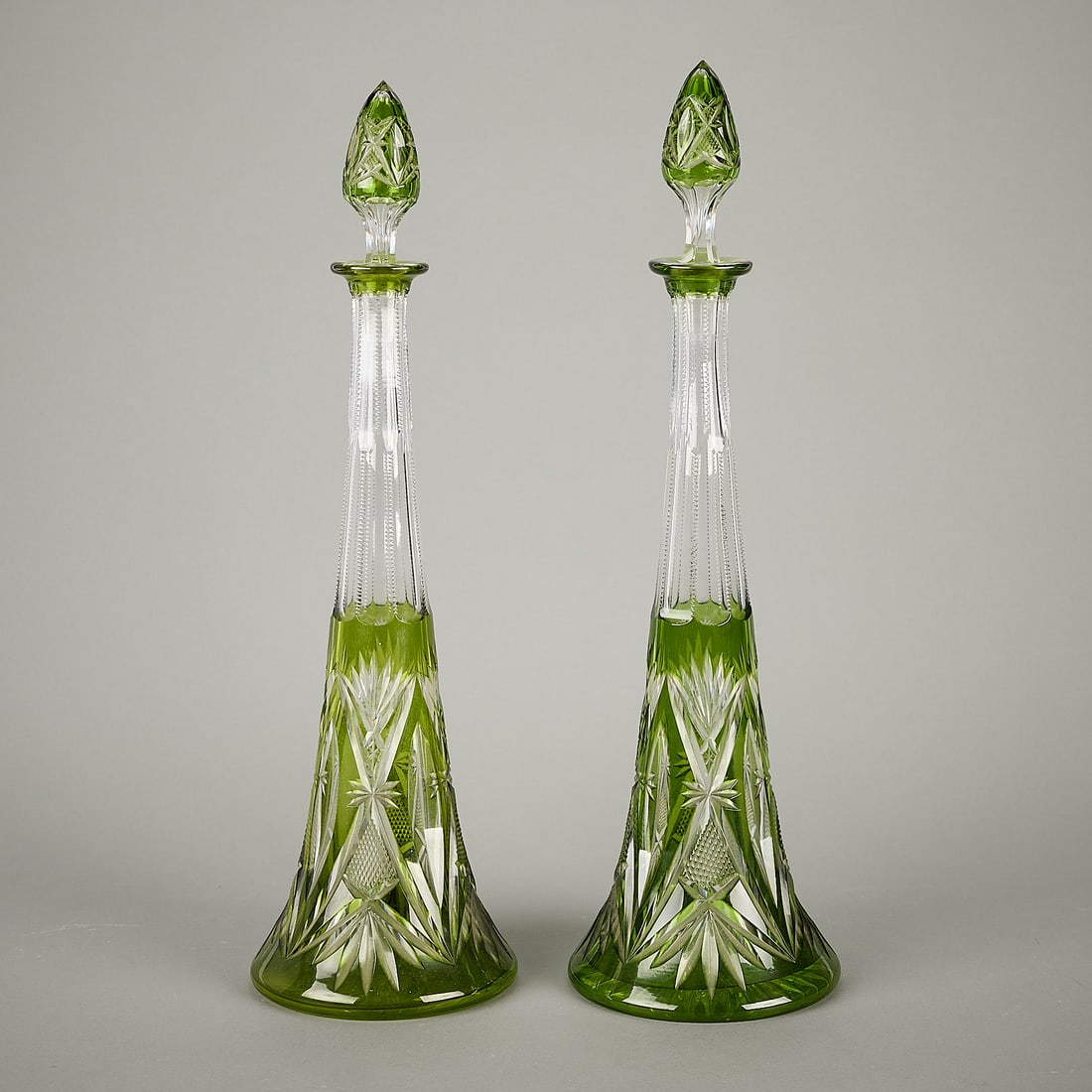 Pair Val St. Lambert Cut Glass Decanters: Val St. Lambert, Belgium. Pair of vintage cut glass overly wine decanters in light green or chartreuse.(Each) height: 17 1/2 in x diameter: 5 in.