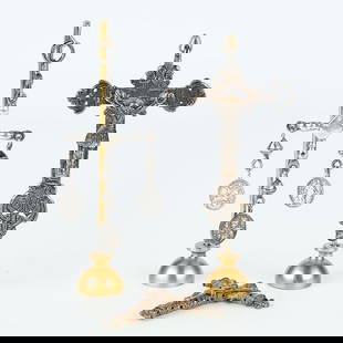 3 Antique Silver Crucifixes: Group of three silver crucifixes. Two crucifixes include carved depictions of the crucified Christ. The other with three small pendants attached. Two with stands.Height ranges from 3 1/4 in to 5 1/2 i