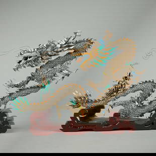 Chinese Silver Enameled Dragon & Fish: Antique Chinese silver enameled dragon and fish figurine with gold gilt finishing and filigree. Rich enameled details in turquoise, orange, amber, and blue. Mounted on a burgundy painted wooden base.H