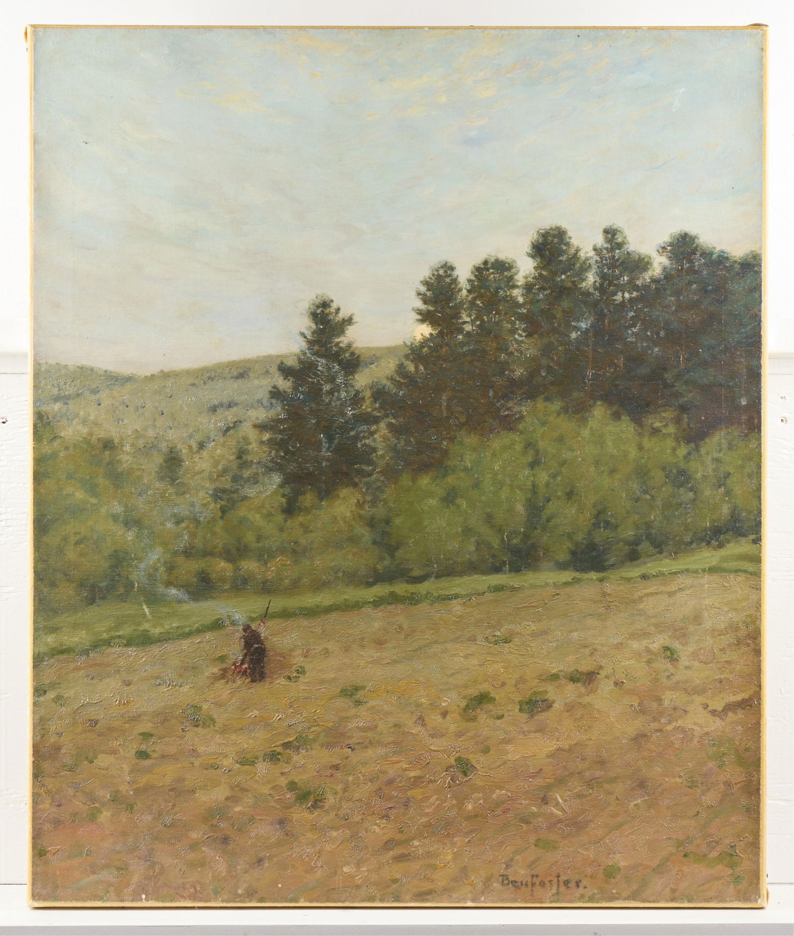 Ben Foster Landscape & Farmer Painting: Ben Foster (American, 1852-1926). Oil on canvas landscape painting depicting a figure gathering hay in a field. Signed along the lower right. Label from Capo Auction, New York along the verso.Height:
