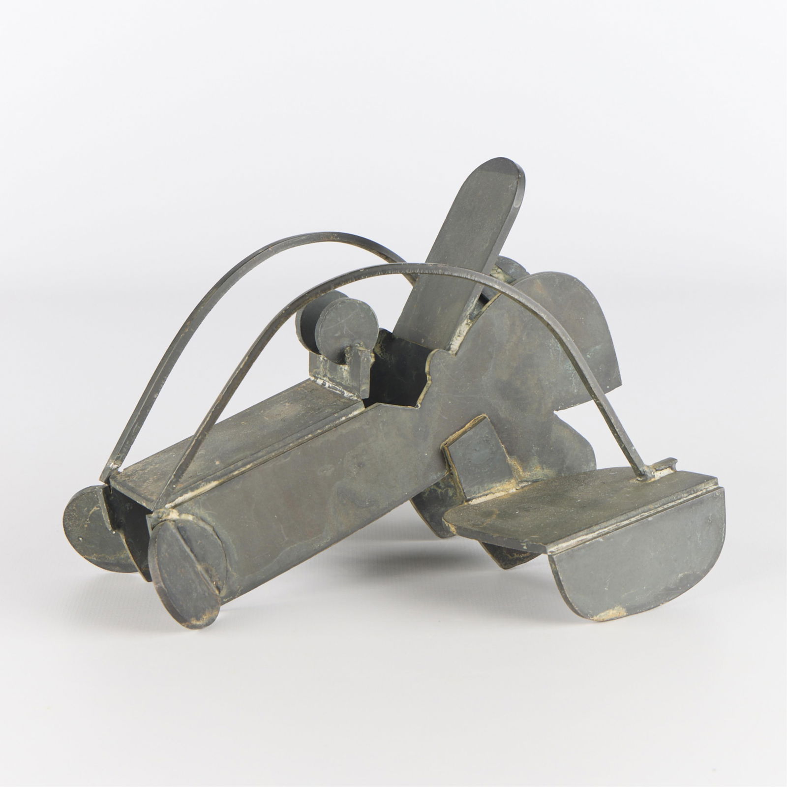 Ernest Trova "Insinuation Table Figure" 1979: Ernest Trova (American, 1927-2009). Patinated sheet metal sculpture titled "Insinuation Table Figure," 1979. Stamped "Trova" with the date along the underside.Height: 5 1/2 in x width: 7 1/4 in x dept