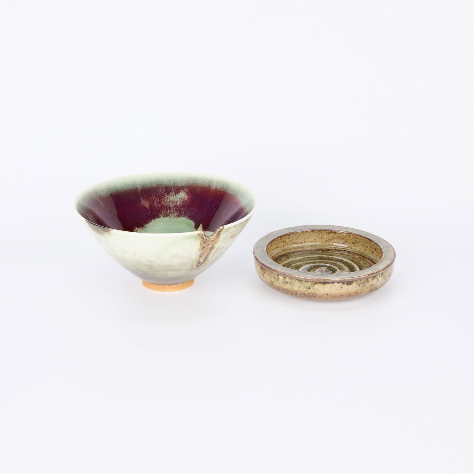 2 Carl-Harry Stalhane for Rorstrand Ceramic Bowls: Carl-Harry Stalhane (Swedish, 1920-1990). Group of two ceramic bowls including a short and dense vessel with a spiral design along the center, akin to Stalhane's "CES" model alphabet bowl, in addition