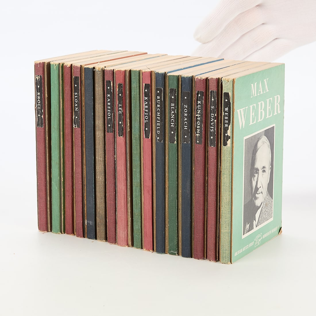 Set 16 Volumes American Artists Group Books: Sixteen illustrated monographs from the American Artists Group collection. Including detailed volumes on Stuart Davis, Max Weber, Charles Burchfield, Gladys Rockmore Davis, William Zorach, Leon Kroll,