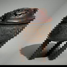 Chinese Ming Dynasty Bronze Censer w/ Wood Lid: Chinese archaistic bronze censer (ding), Ming dynasty. Of a stout cylindrical form with loop handles along either side of the vessel and elaborately incised geometric taotie mask motifs. Resting on th