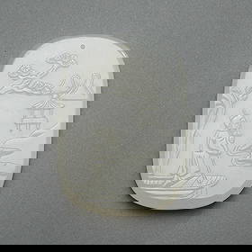 20th c. Chinese Carved White Jade Pendant: Chinese carved white jade slab pendant or plaque, 20th century. With one side depicting a scholarly figure rowing a boat along a shoreline landscape; the reverse with twelve-character inscription, pos