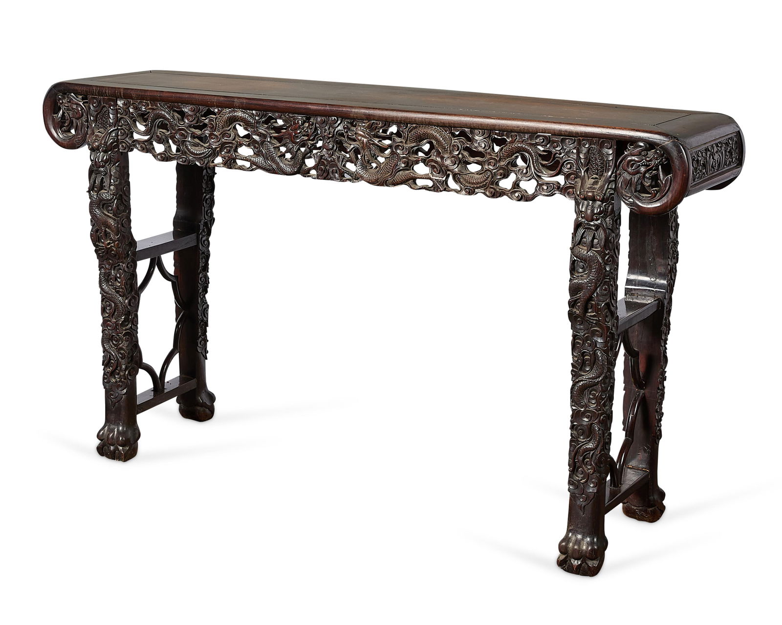 Chinese Qing Carved Rosewood Altar Table: Antique Chinese carved rosewood altar or console table, Qing dynasty, late 19th-20th century. With intricately reticulated frieze depicting dragons and scrollwork motifs, carved scroll table top, and