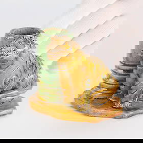 Chinese Ming Sancai Porcelain Tiger Incense Vessel: Chinese tricolor sancai pottery vase vessel or joss stick incense holder in the form of a seated tiger, Ming dynasty. Earthenware with amber-yellow and light green glaze.Height: 3 1/4 in x width: 3 3/