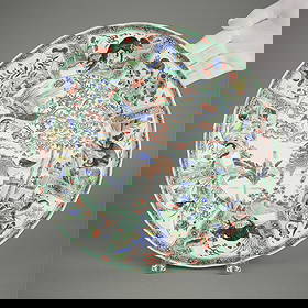 Chinese Kangxi Famille Verte Charger - Restored: Chinese famille verte porcelain charger, Kangxi period, 18th century. The platter with cartouches depicting mythical beasts within landscapes throughout. Marked along the underside.Height: 2 1/2 in x