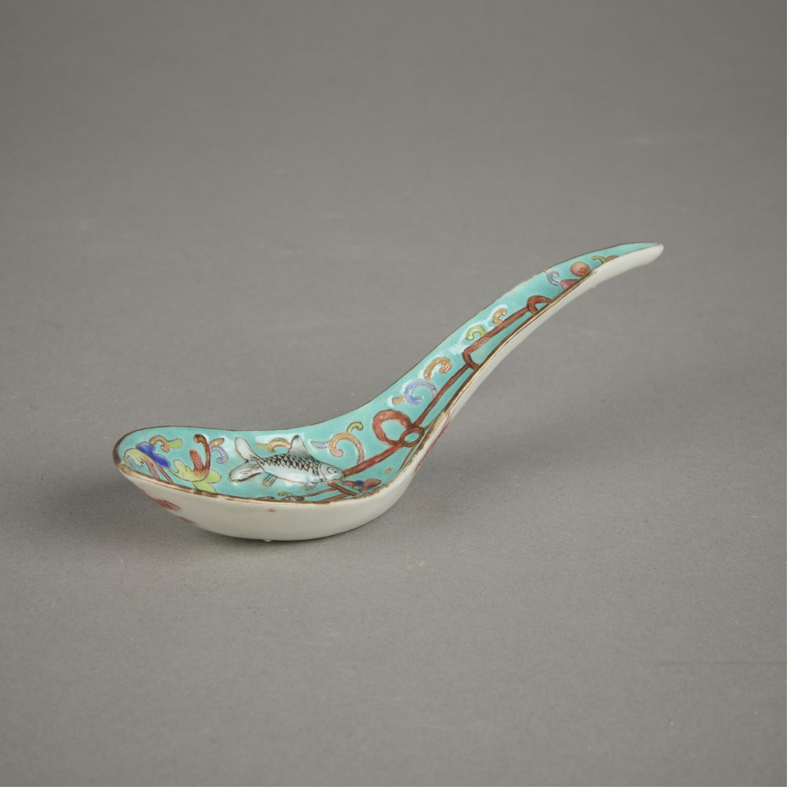 Chinese Qing Molded Fish Porcelain Spoon: Chinese Qing dynasty porcelain spoon, ca. Tongzhi period. Molded with twin fish and famille rose enamels on a teal ground.Provenance: Ming to Ch'ing Antique Oriental Arts, Chicago, 1981.Length: 5 1/2