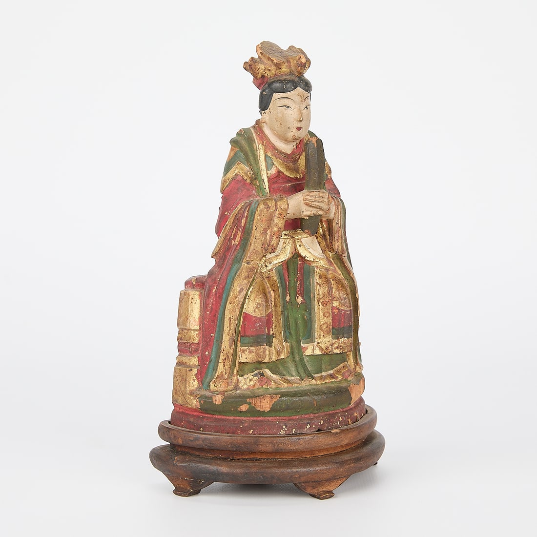 Chinese Carved Wood & Polychrome Figure: Chinese carved wooden figure with gilt and polychrome pigment. Depicting a seated and robed noble woman. Height: 7 in x width: 4 in x depth: 2 1/2 in.