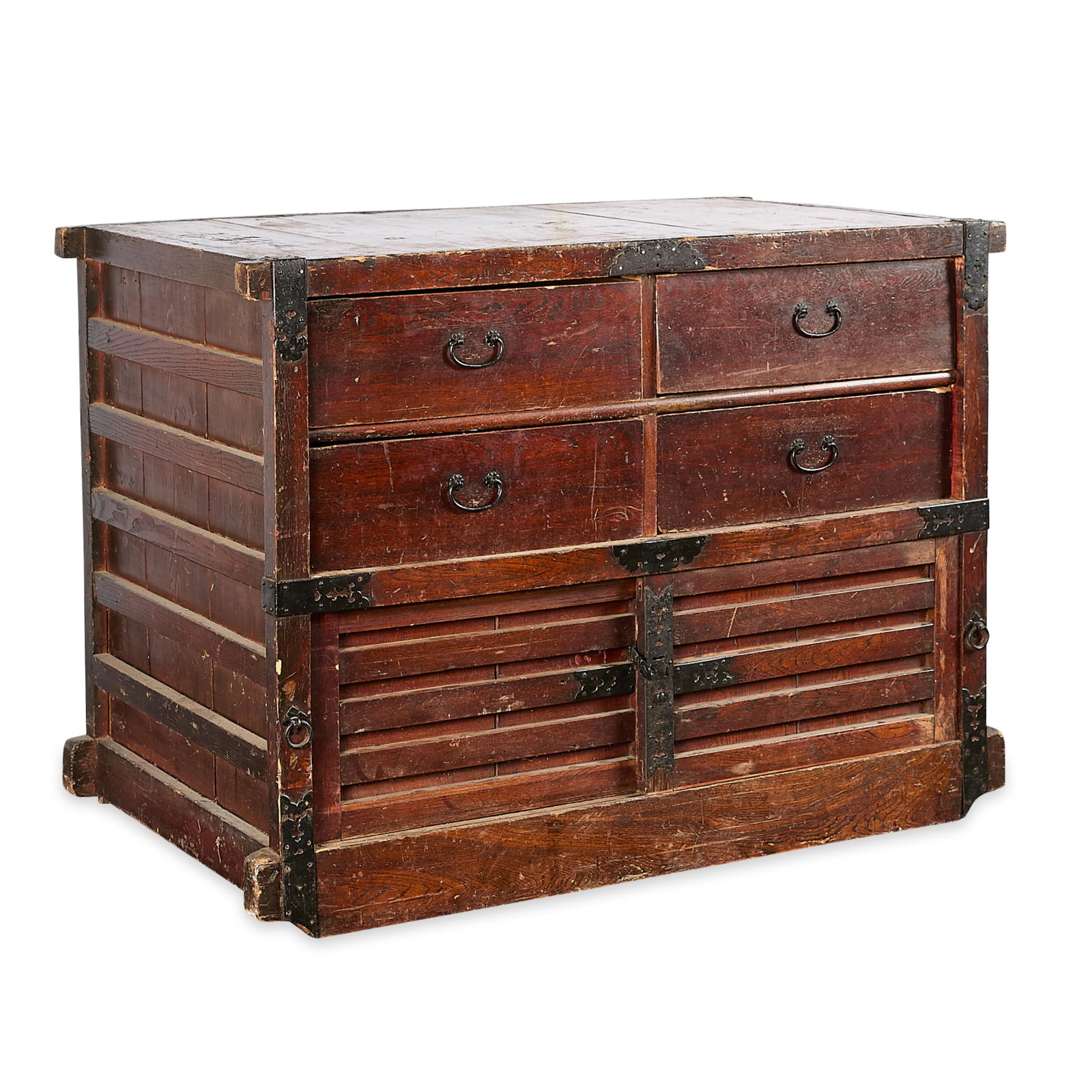 Japanese Edo Wooden Tansu Chest of Drawers: Japanese Edo Period wooden tansu or chest of drawers, also known as a kuruma-dansu. With ornate C-form handles, pierced strap hinges, and six pull-out drawers. Height: 41 in x width: 56 in x depth: 32