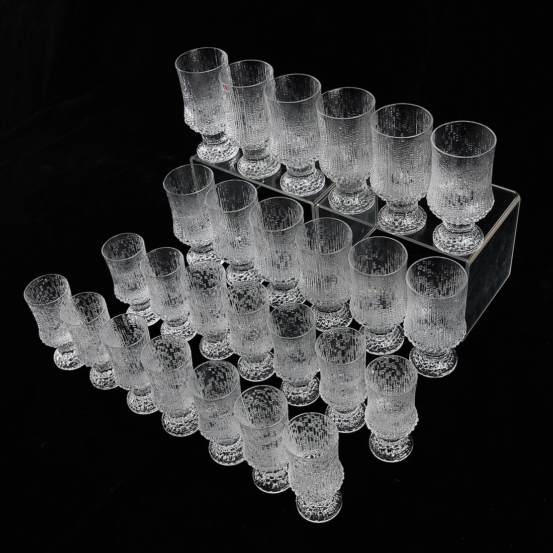 26 Pcs Iittala Ultima Thule Glass Crystal Stemware: Tapio Wirkkala (Finnish, 1915-1985) for Iittala, Finland. Set of 26 glass crystal stemware in iconic melting ice or icicle-inspired pattern "Ultima Thule." Includes 12 wine glasses and 14 sherry glass