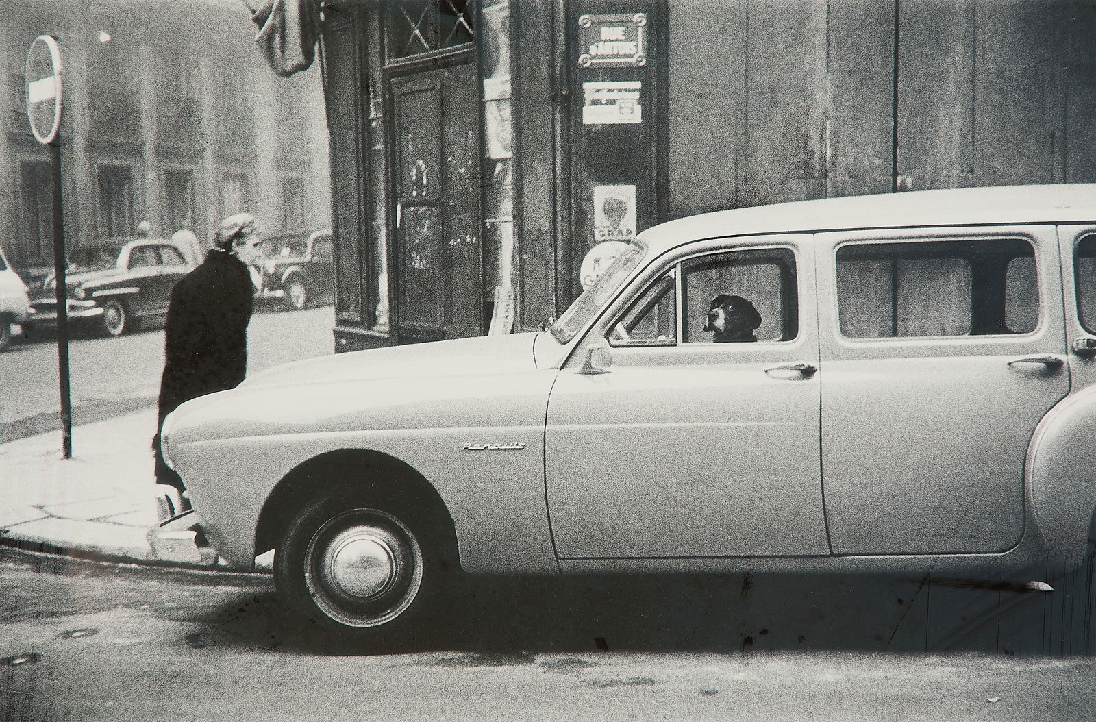 Elliott Erwitt "Paris, France" GSP Photo 1957: Elliott Erwitt (French/American, 1928-2023). Gelatin silver print photograph titled "Paris, France," 1957. Comically depicting a dog behind the wheel of a car. Signed, titled, and dated along the vers