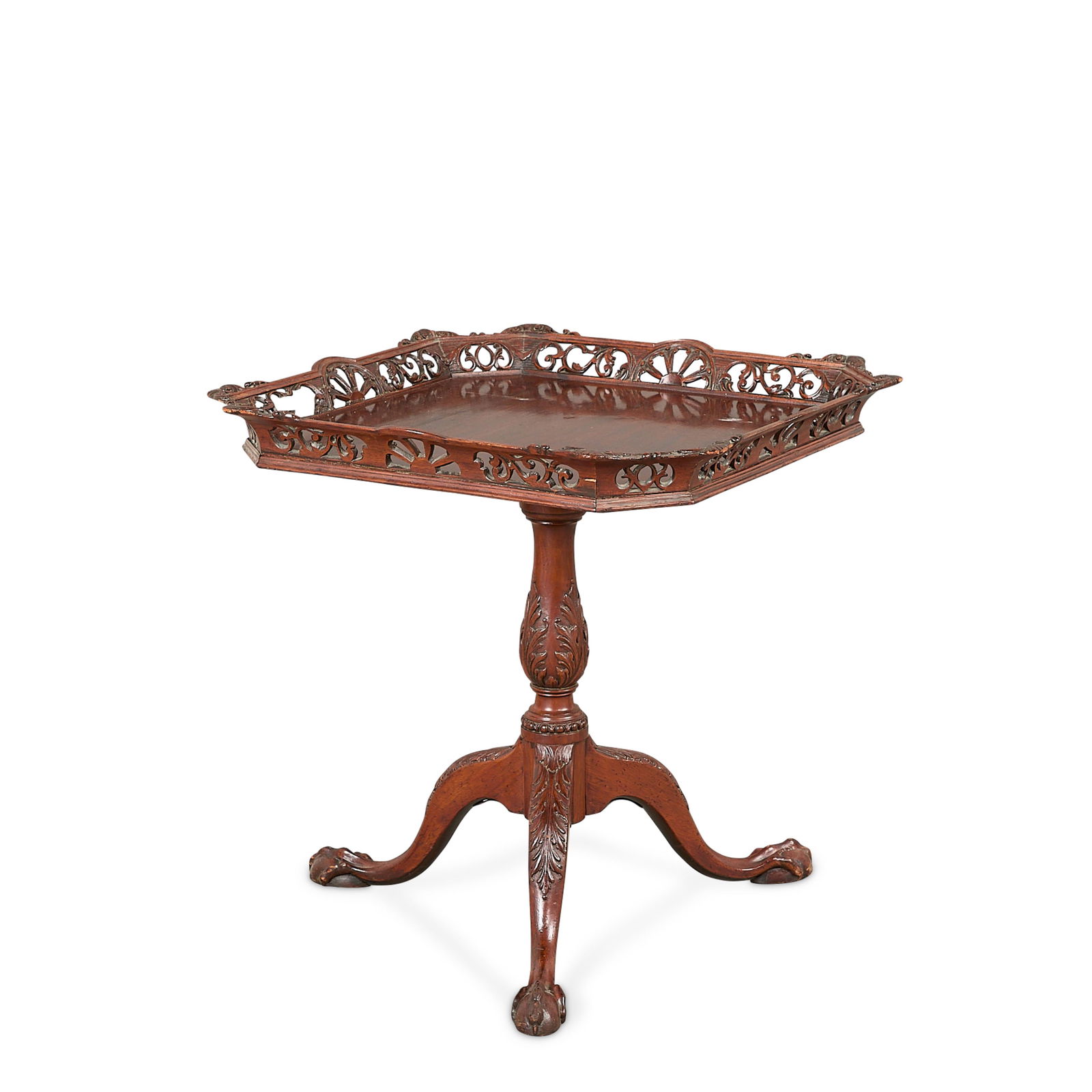Chippendale Style Snap-Top Pierced Edge Tea Table: English George III-style or Chippendale-style wooden snap-top tea or side table with carved reticulated edge and square tilting table surface, early 20th century. Surmounted atop a tripod base