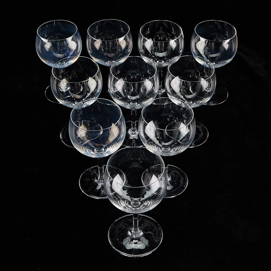 Set 10 Baccarat "Volnay" Wine Goblet Glasses: Baccarat, France. Set of ten "Volnay" pattern crystal blown glass stemware water goblets or wine glasses, 20th century. Each with etched mark along the underside.(Each) Height: 6 1/2 in x diameter: 3