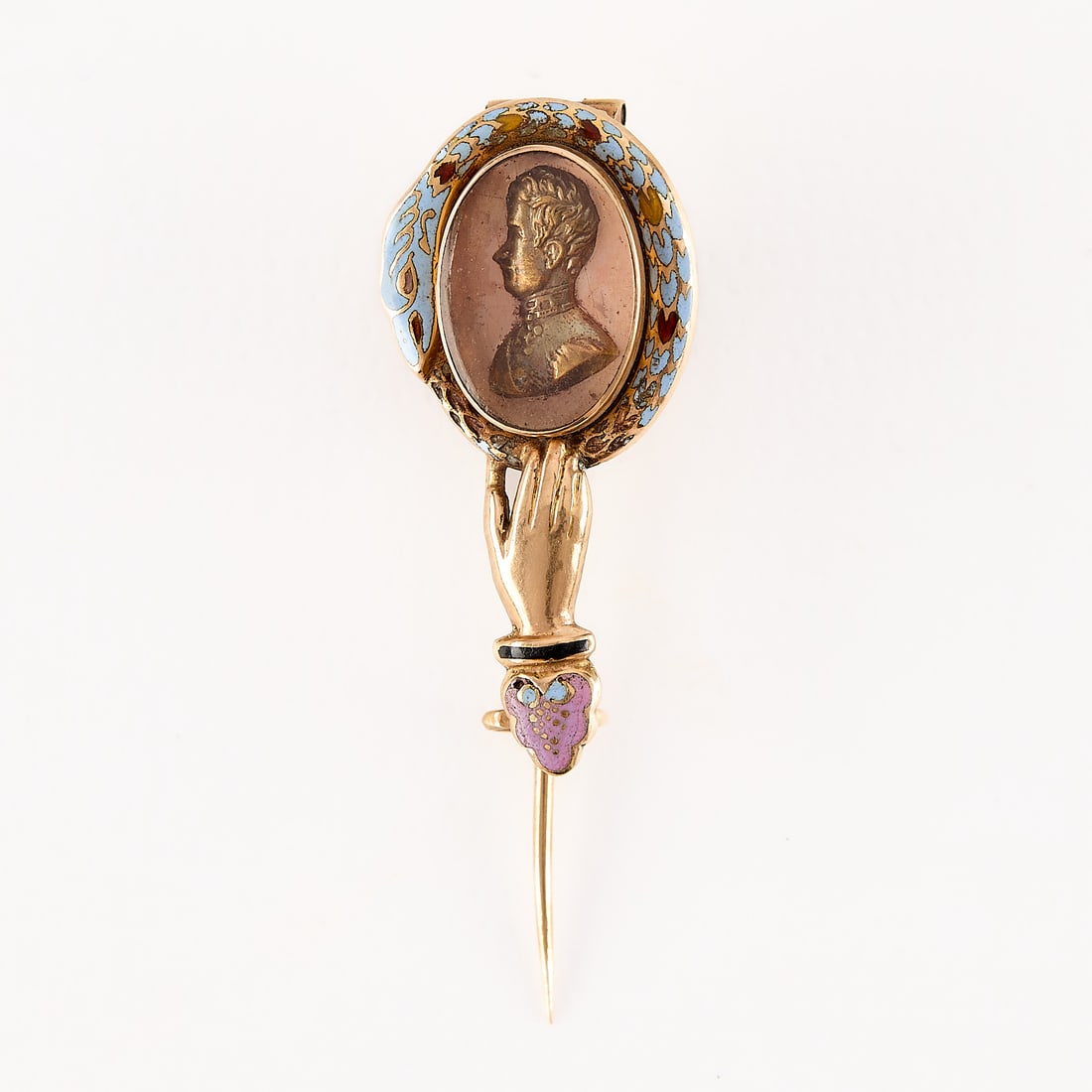 French 18k Bourbon Restoration Era Charles X Pin: 18k yellow gold stick pin comprised of a heart and hand supporting an enclosed vignette. with fine enameled details in blue, pink, black, red and orange. With additional, empty enclosed vignette along