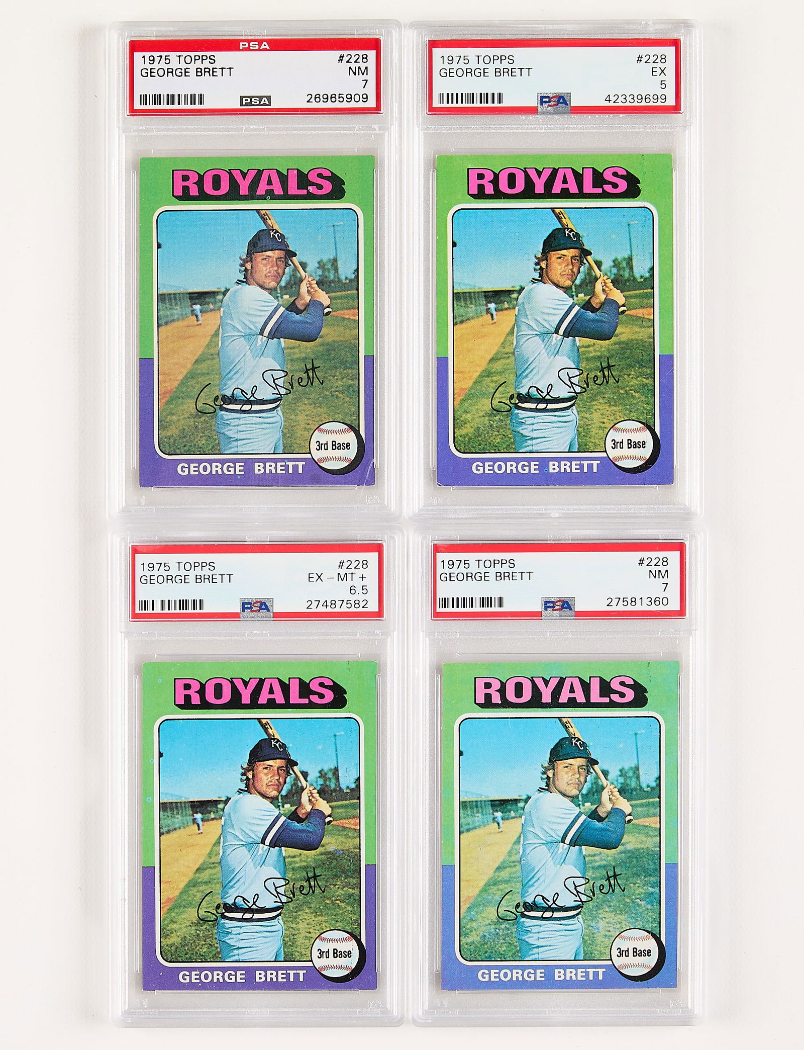 4 1975 Topps George Brett Rookie Cards PSA: Group of four 1975 Topps George Brett #228 rookie baseball cards including: NM 7, 27581360. NM 7, 26965909. EX-MT+ 6.5, 27487582. EX 5, 42339699. (Case) Height: 5 1/4 in x width: 3 1/4 in.