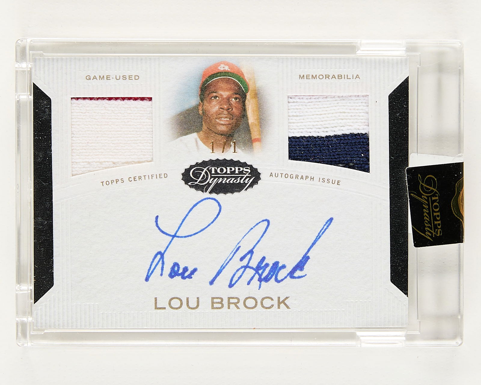 2016 Topps Dynasty Lou Brock Auto 2x Patch 1/1: 2016 Topps Dynasty #ADRG-LB2 two relic and autograph, Lou Brock, 1/1. (Case) height: 4 1/2 in x width: 3 in.