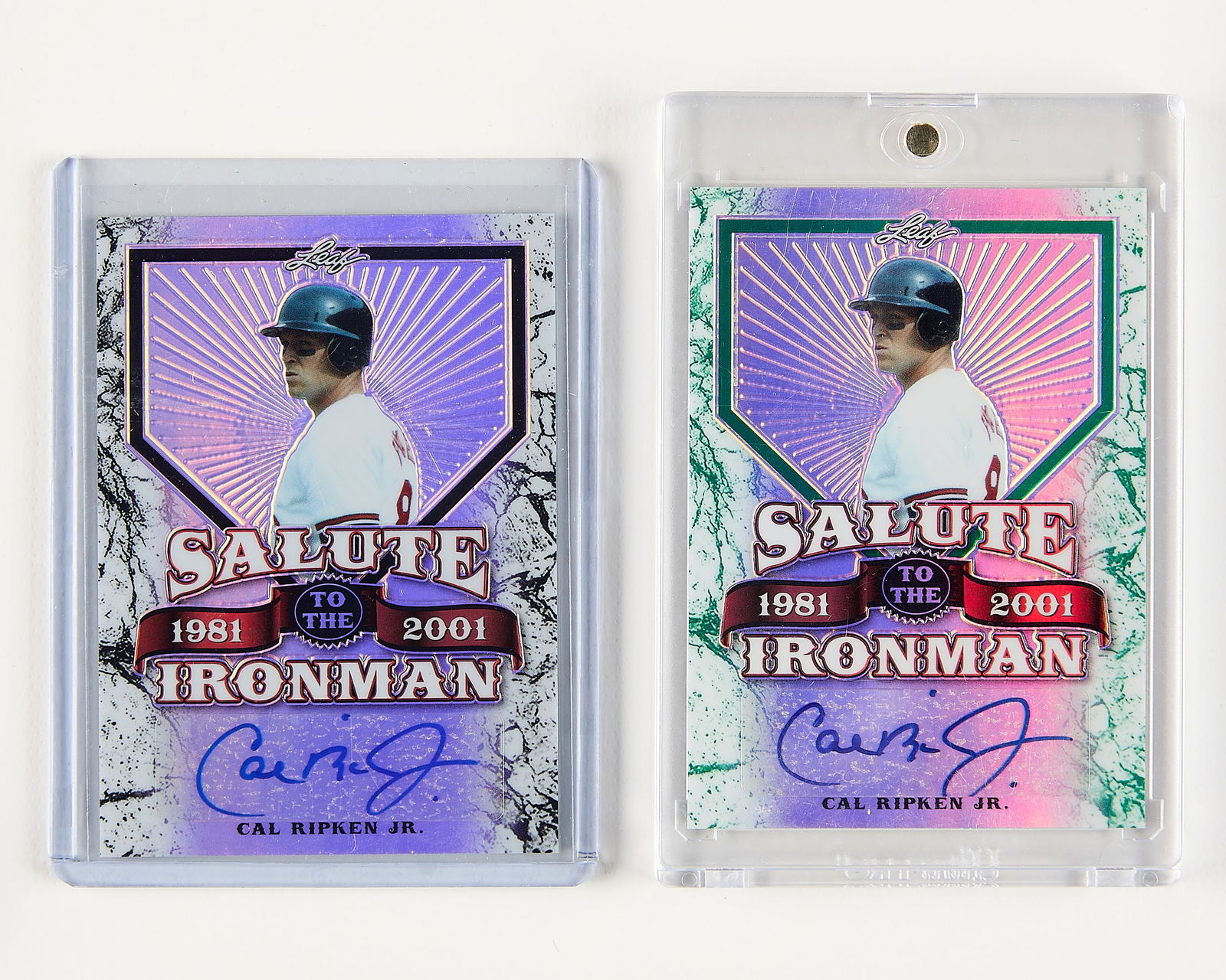 2 Leaf Lim.Ed. Cal Ripken Jr. Auto Cards: Group of two Leaf 'Salute to the Ironman' #SI-CR8 Cal Ripken Jr. autographed baseball cards. Including: one green, 3/7; one black, 9/10.(Case) height: 4 1/2 in x width: 3 in.