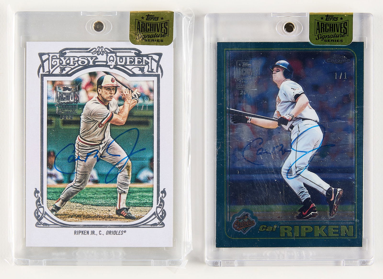 2 Topps Cal Ripken Auto 1/1 Cards: Group of two Topps Cal Ripken 1/1 autograph cards. Including:2013 Gypsy Queen #120 2015 Archives Signature Series, signed in blue ink.2001 Topps Chrome #1 2015 Archives Signature Series, signed in blu