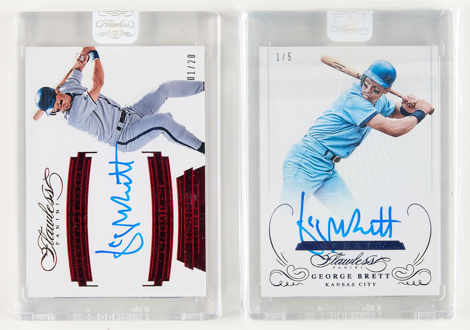 2 Panini Flawless George Brett Signed Cards: Group of two Panini Flawless George Brett autograph cards. Including:2016 Flawless Greats #GA-GB, blue, 1/5.2017 Flawless Memorable Marks #MM-GB, red, 1/20.(Cases, each) height: 4 in x width: 3 in.