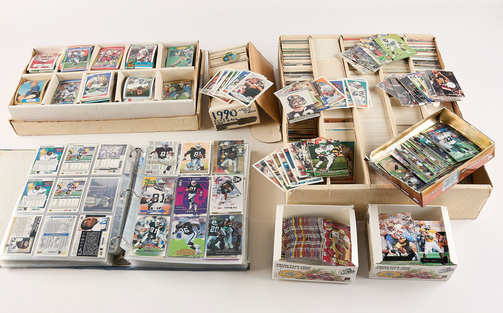 Lrg Collection Sports & Football Trading Cards: Large collection of sports trading cards, primarily related to the NFL and professional football players. (Shipping dimensions) Height: 11 in x width: 18 1/2 in x depth: 15 in.