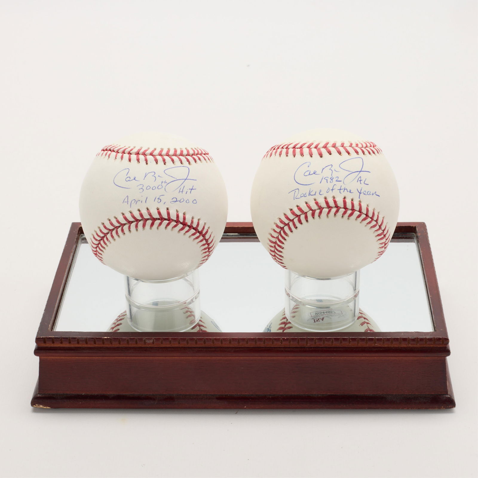 2 Cal Ripken Signed Baseballs w/ COA: Group of two Cal Ripken Jr. autographed baseballs in a display case. One ball, JSA: W544657. One ball with letter of authenticity from denverautographs.com, autographed Dec. 1, 2012. (Case) Height: