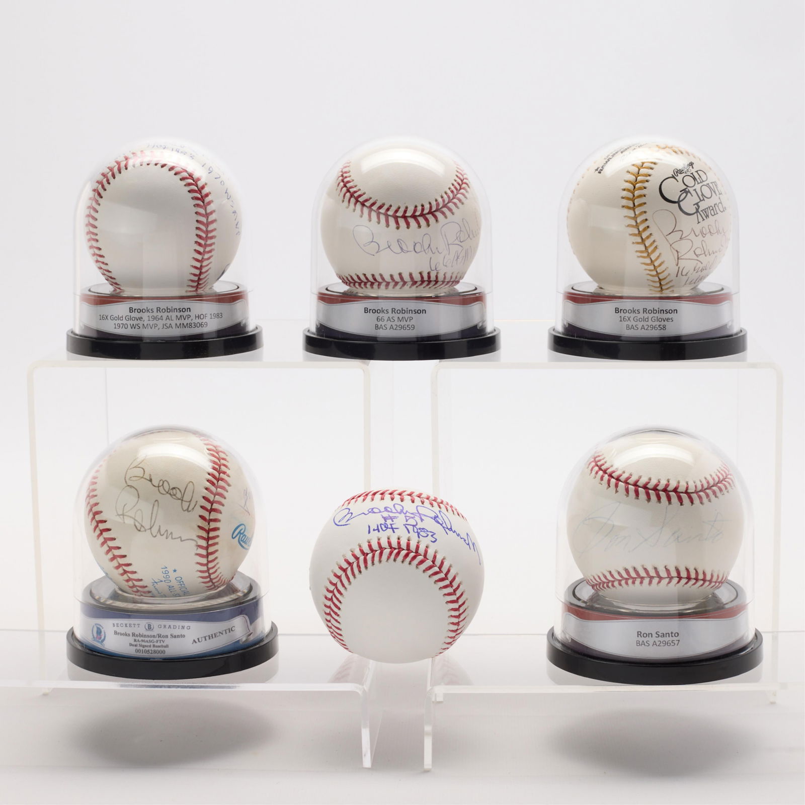 6 Signed Baseballs - B.Robinson & R.Santos: Group of six autographed baseballs signed by Brooks Robinson and/or Ron Santos. Including: Four Brooks Robinson (BAS: A29658, A29659, A35168, JSA: MM83069); Brooks Robinson and Ron Santo (BAS: