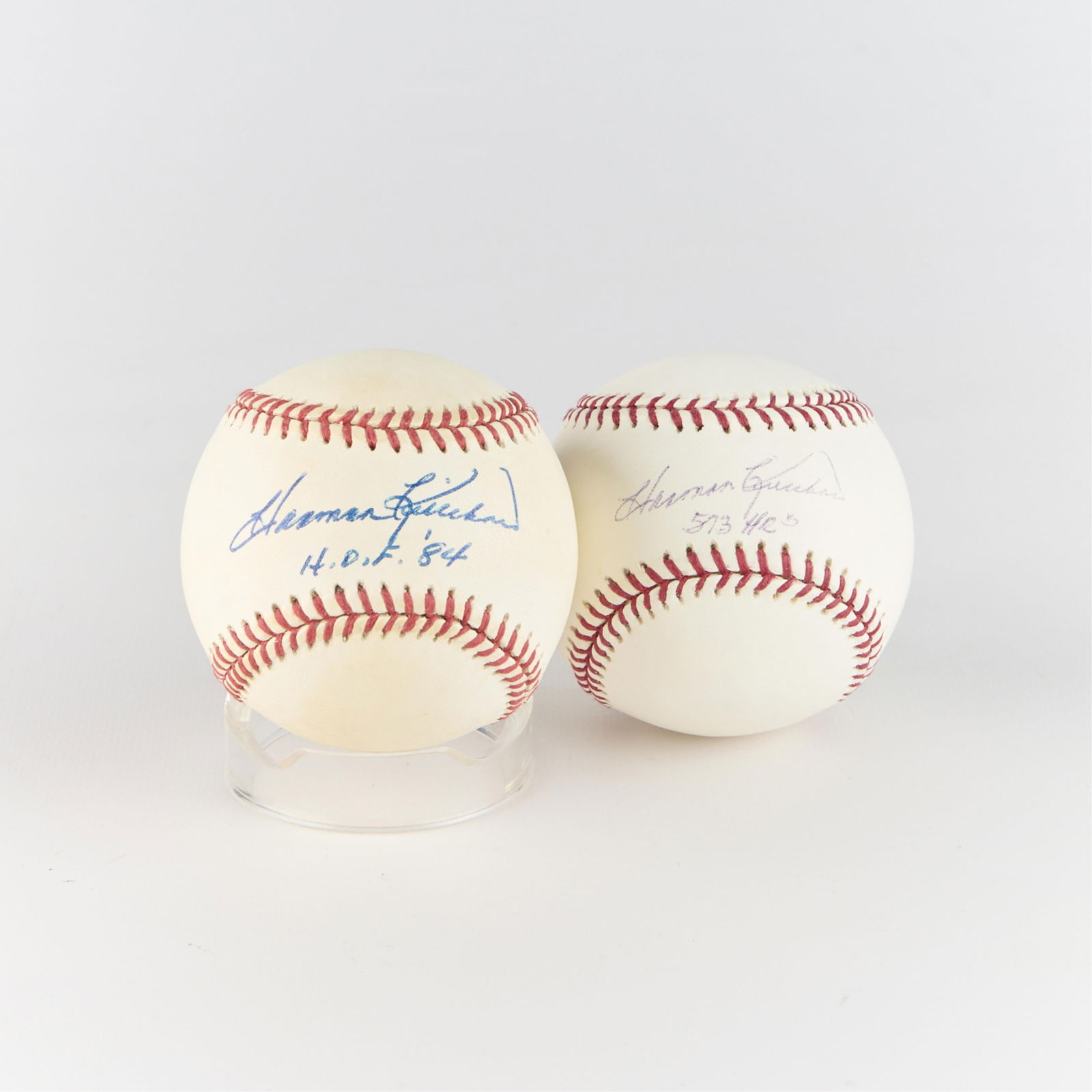 2 Harmon Killebrew Signed Baseballs: Group of two signed baseballs by Harmon Killebrew. One additionally inscribed "573 HR's" and the other inscribed "H.O.F. '84." Diameter, each: 3 in.