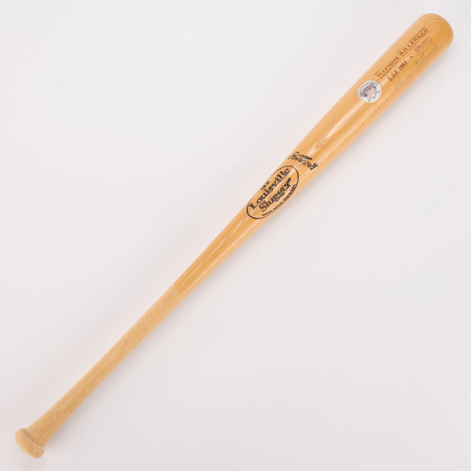 Harmon Killebrew HOF Twins Bat Signed: Harmon Killebrew signed Minnesota Twins baseball bat. Louisville Slugger 180, powerized. Emblem or sticker with home run stat and hall of fame induction date. Engraved with name, H.O.F. 1984, and 573