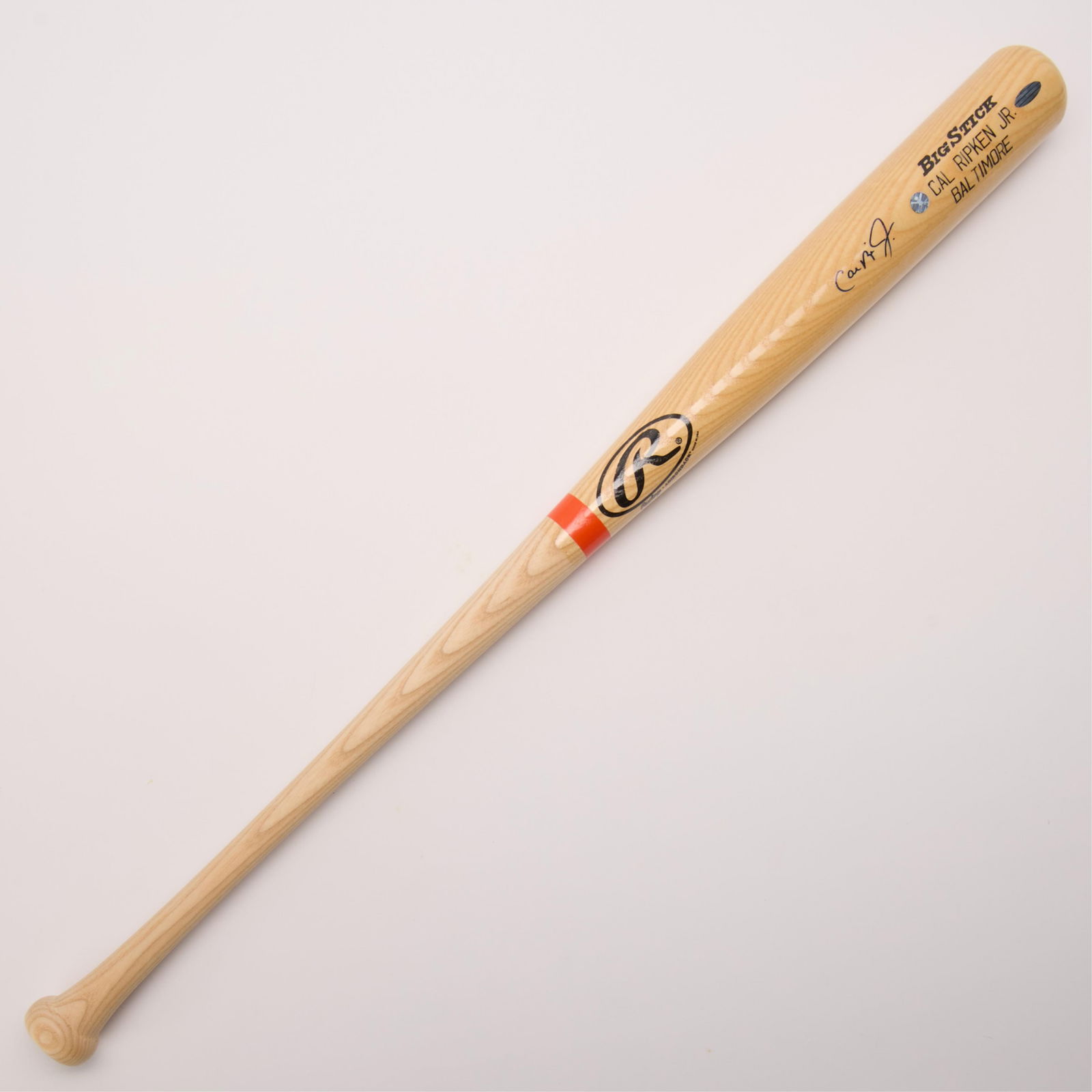 Framed Cal Ripken Signed Bat in Case w/ COA: Rawlings Adirondack Big Stick baseball bat signed in dark blue ink. In an Orioles branded baseball display case. Steiner certificate of authenticity.(Case) height: 7 1/2 in x width: 39 1/4 in x depth: