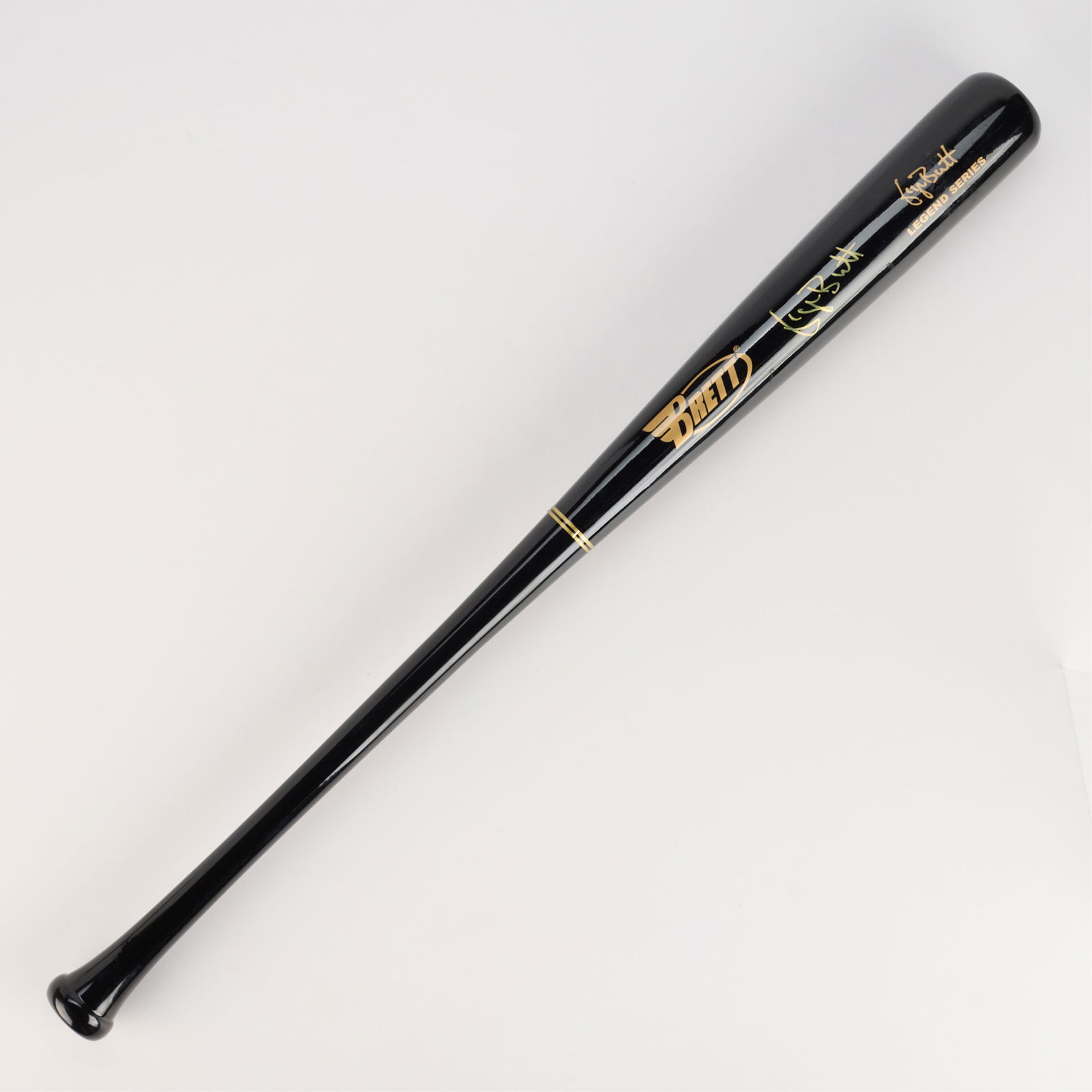 George Brett Signed Brett Bat PSA: Black Brett legend series baseball signed in gold ink. PSA: H81406. Bat length: 34 in.