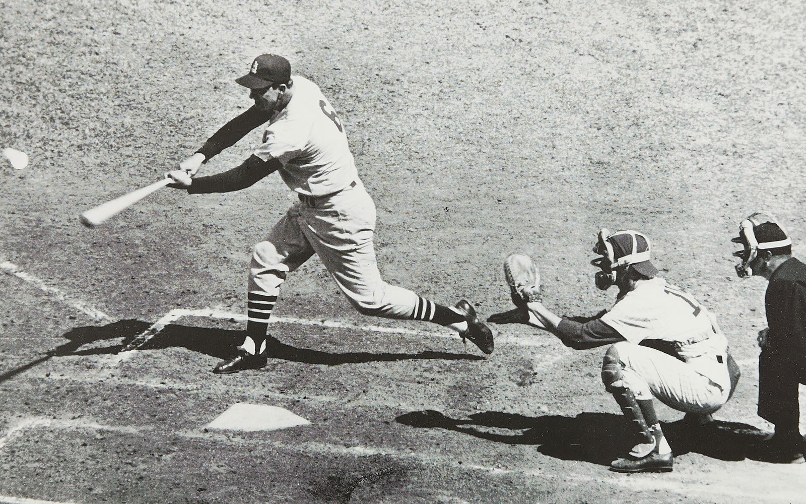 Stan Musial Signed The Sporting News Photo: The Sporting News autographed print signed by Stan Musial. With a Stan the Man Certificate of Authenticity: SM6 BB27039. Autographed in pen below the image. Sight; height: 15 1/2 in x width: 19 1/2