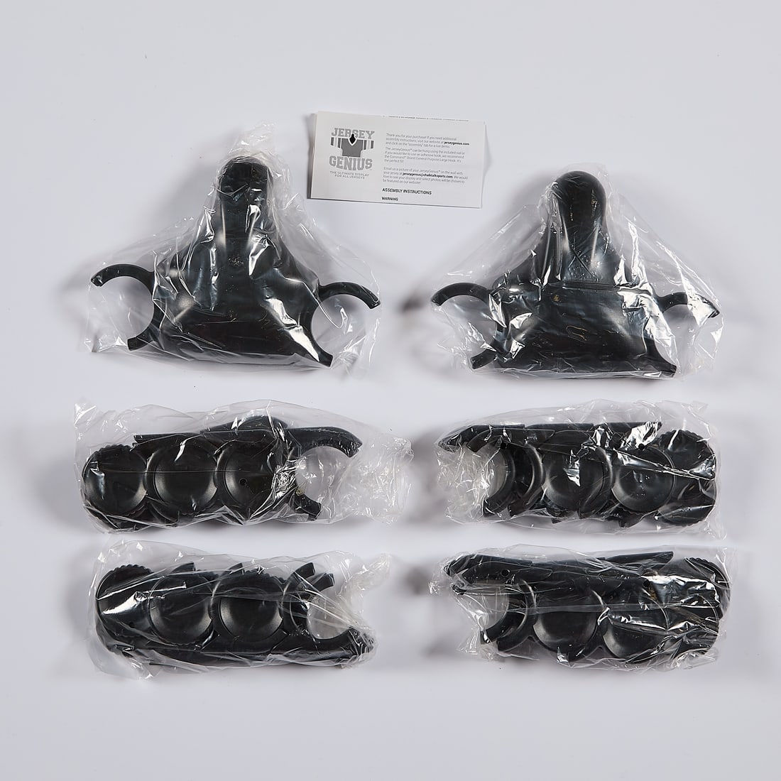 2 Jersey Displays NIB: Two Jersey Genius jersey displays. New in box. (Boxes, each) height: 4 in x width: 11 in x depth: 7 in.