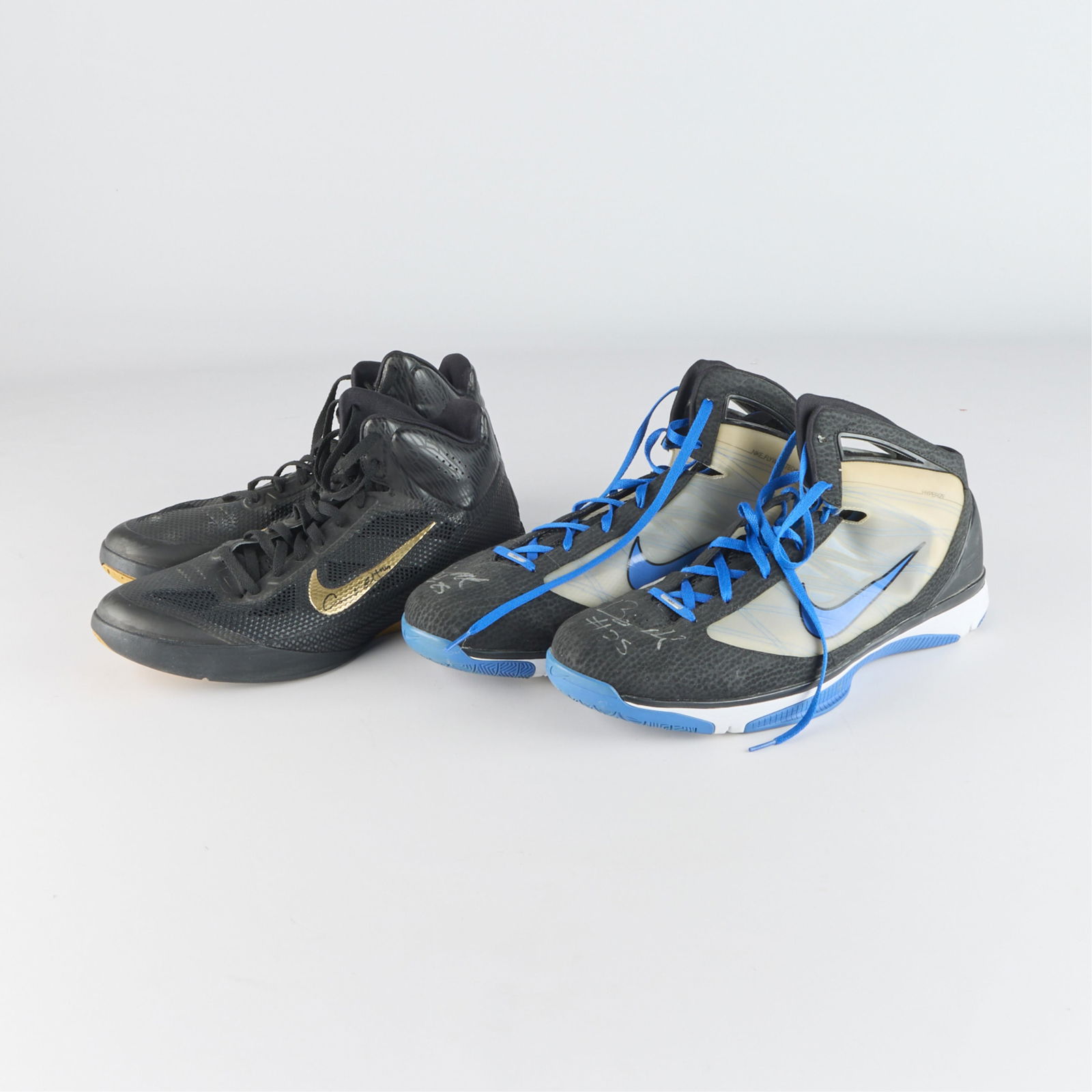 2 Pairs Signed Game Used Basketball Shoes: Both Timberwolves shoes, one signed by Anthony Tolliver and the other signed by Big Al Jefferson. (Shipping dimensions) height: 13 in x width: 16 in x depth: 15 in.