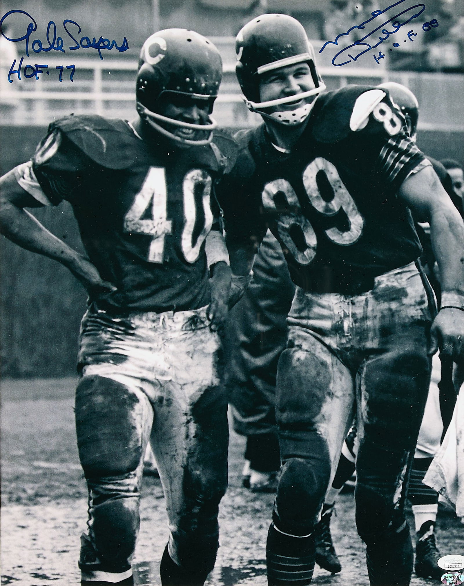 Mike Ditka & Gale Sayers Signed Photo JSA: Mike Ditka and Gale Sayers autographed photograph. Both signed in blue ink with Hall of Fame induction dates. JSA: DD85930. Sight; height: 18 3/4 in x width: 15 in. Framed; height: 29 1/2 in x width: