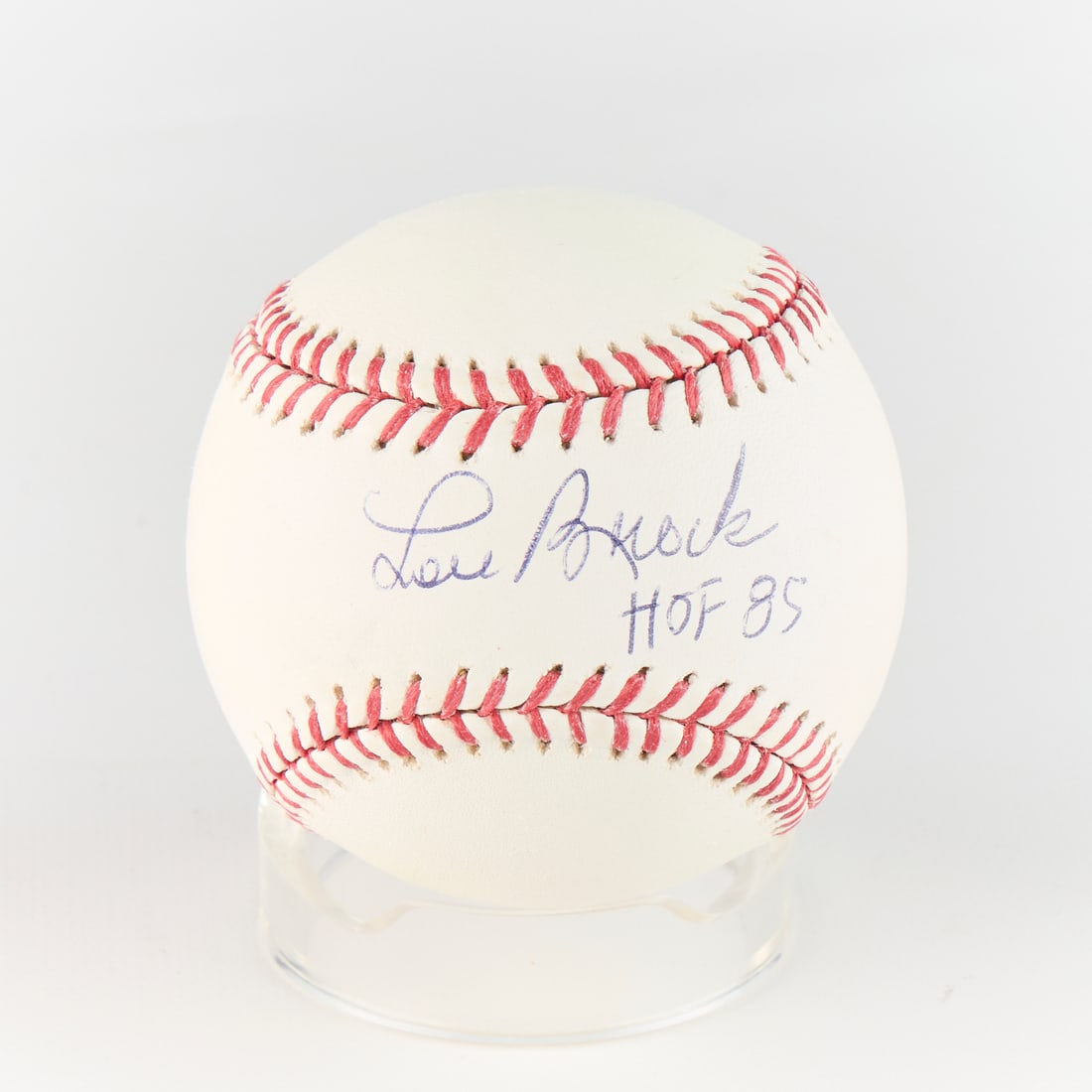 Lou Brock Signed Baseball: Baseball signed by Lou Brock and inscribed HOF 85. JSA: I13789. Diameter: 3 in.