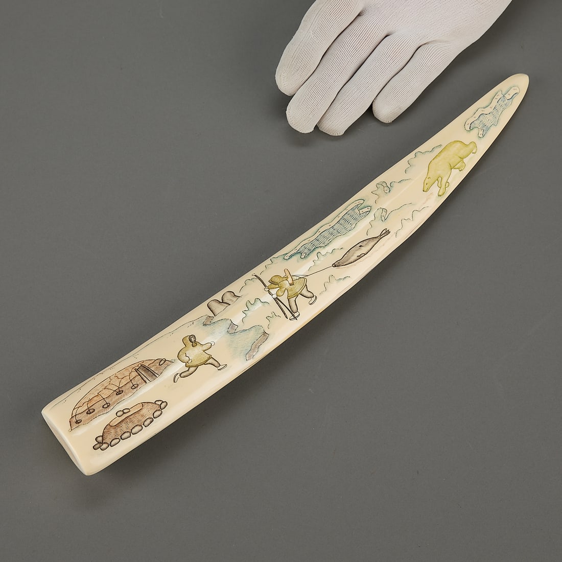 Chukchi Pictorial Carving w/ Hunters & Mammals: Chukchi or Siberian Yupik carved, incised and pigmented organic material depicting hunters whales and seals, 1993. Provenance: Heard Museum, Arizona; Private Collection, New York. Length: 15 1/2 in.