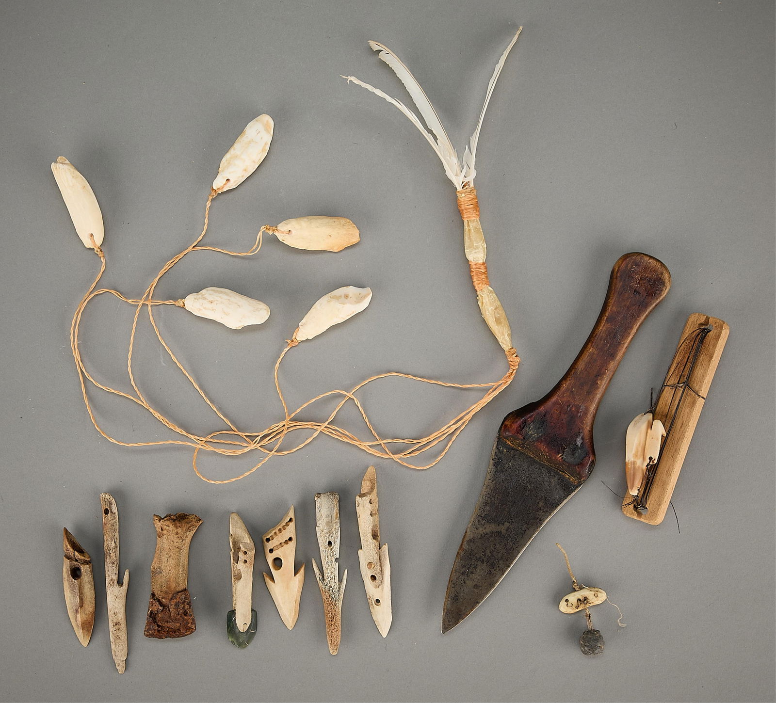 9 Pcs Yupik & Inuit Hunting Tools: Group of nine Pacific Northwest Yu'pik (Alaskan) and Inuit tools. Including: Peter Lind Jr. (Alaskan (Aleut/Alutiiq), b. 1930). Carved organic material, sinew, and seal gut bola instrument for bird hu