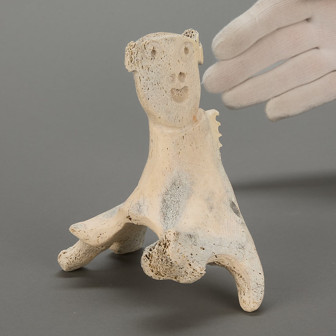 Inuit Shaman Carving w/ Faces: Inuit carving of a shaman with two faces. Unsigned.Provenance: Private Collection, New York.Height: 7 in x width: 5 1/2 in x depth: 3 in