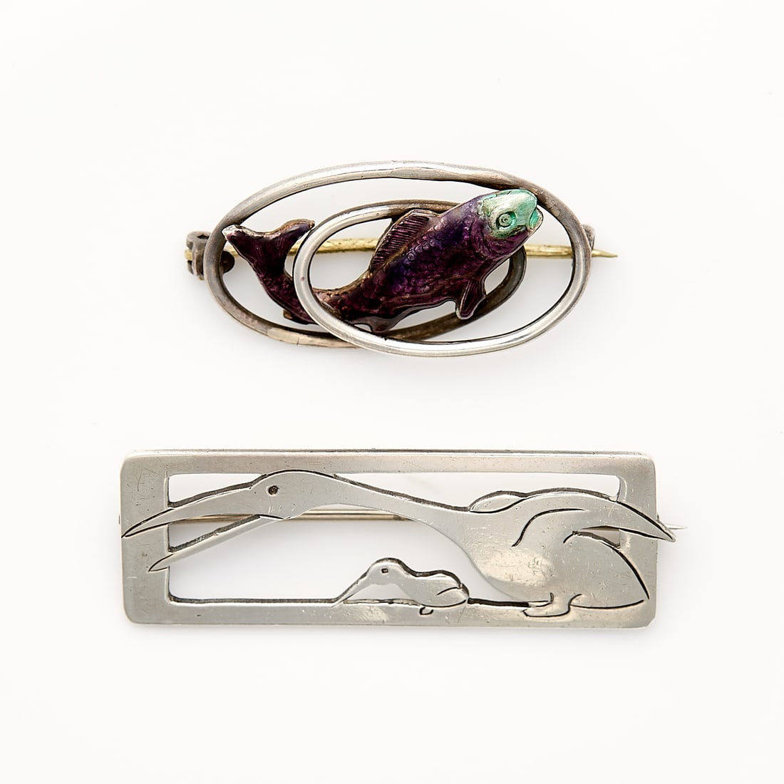 Potter Studio & Charles Horner Silver Brooches: One Potter Studio silver brooch depicting a mother & child birds, marked for Potter Studio, tested silver. One Charles Horner Arts & Crafts sterling and enamel fish brooch marked for Charles Horner, C